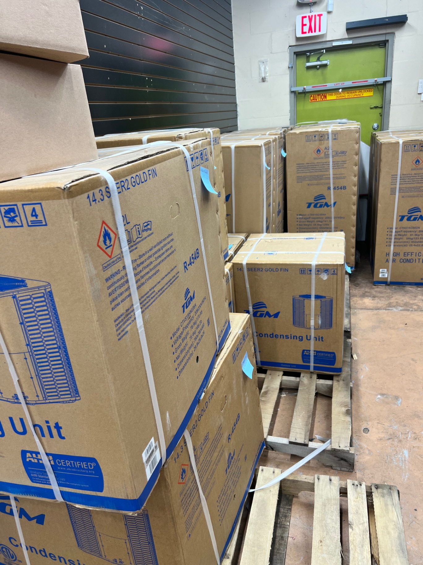 TGM 14.3 SEER2 condensing units on pallets at AirPrime Distribution's Tampa warehouse